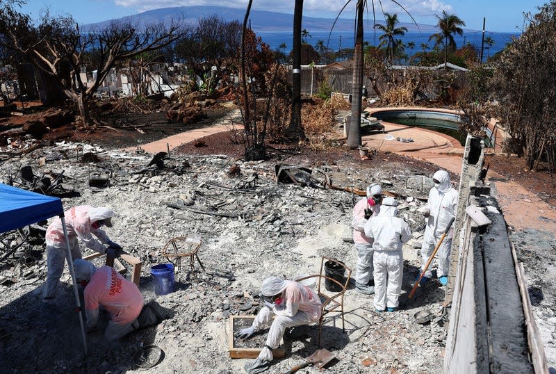 Volunteers from Samaritan’s Purse help displaced residents search for meaningful personal items at their wildfire destroyed home on October 05, 2023 in Lahaina, Hawaii.