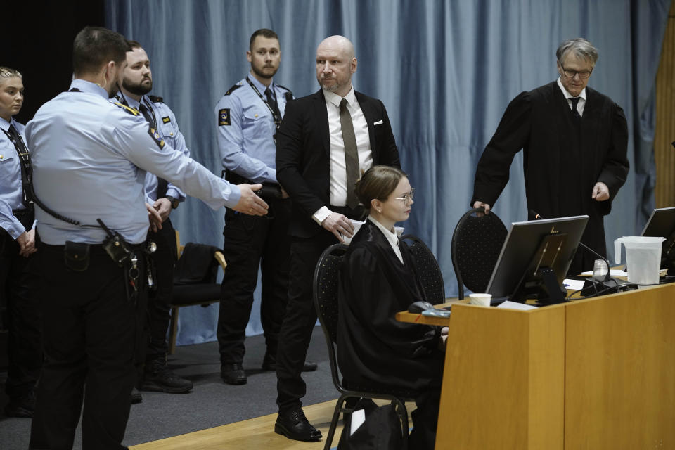 Right-winged extremist Anders Behring Breivik center, enters the Oslo district court conducting his case in a gymnasium at Ringerike prison, in Ringerike , Norway, Monday, Jan. 8, 2024. Breivik, who slayed 77 people in an anti-Islamic bomb and gun rampage in 2011, appeared in court on Monday in a bid to sue the Norwegian state for breaching his human rights. Norway’s worst peacetime killer says his solitary confinement since being jailed in 2012 amounts to inhumane treatment under the European Convention of Human Rights .(Cornelius Poppe/NTB Scanpix via AP)