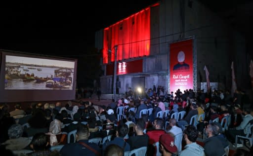 Palestinian film lovers watch a rare screening in the Gaza Strip, held outdoors after the owner of one of the territory's disused cinemas withdrew permission for it be used as a venue