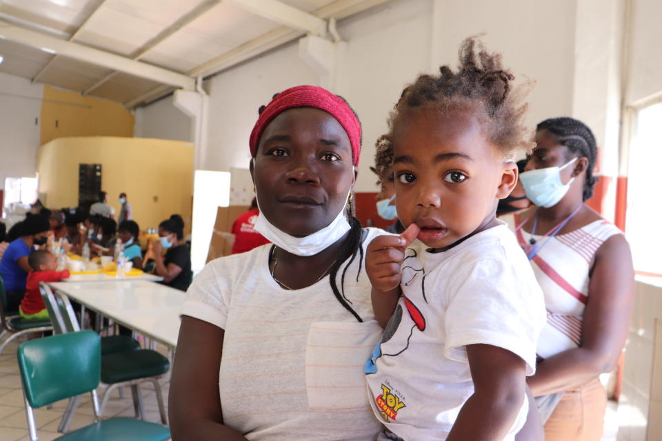 Ana Estache, from Port-au-Prince, Haiti, poses for a photo with her two-year-old son in Monterrey, Mexico, Thursday, Sept. 23, 2021, after traveling from Chile where they lived before. Estache, 43, who traveled with her husband and two children, said has considered returning to Chile, but said she still dreams of getting to the U.S. for a chance at a better life. (AP Photo/Marcos Martinez Chacon)