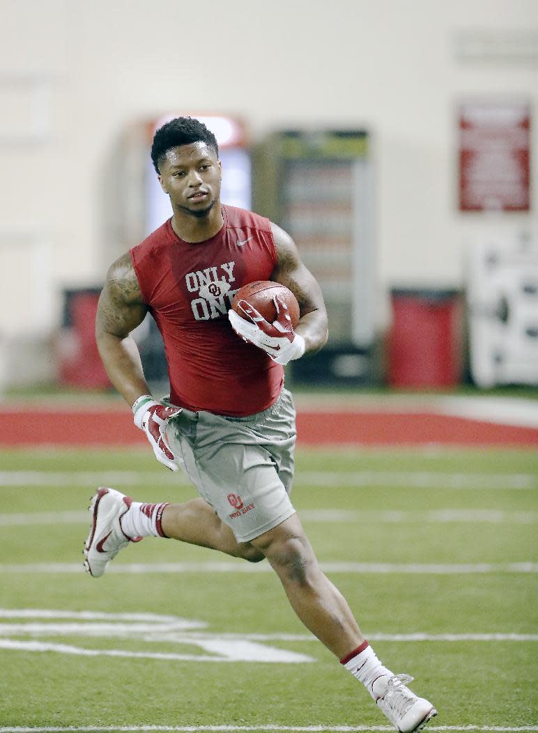 Running back Joe Mixon runs a drill at Oklahoma's Pro Day, Wednesday, March 8, 2017, in Norman, Okla. The event is to showcase players for the upcoming NFL football draft. (AP Photo/Alonzo Adams)