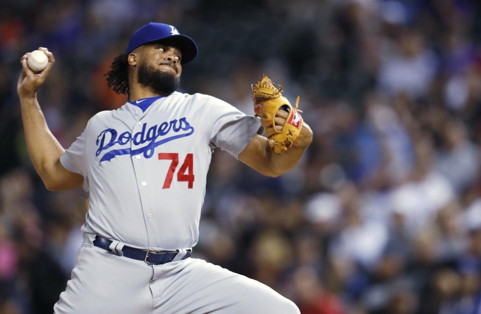 Los Angeles Dodgers reliever Kenley Jansen throws to a Colorado Rockies batter during the ninth inning of a baseball game Friday, May 12, 2017, in Denver.