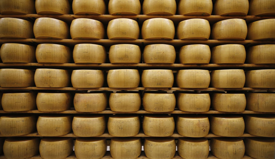 In this photo taken Tuesday, Oct. 8, 2019, Parmigiano Reggiano Parmesan cheese wheels are stored in Noceto, near Parma, Italy. U.S. consumers are snapping up Italian Parmesan cheese ahead of an increase in tariffs to take effect next week. The agricultural lobby Coldiretti on Friday, Oct. 11, 2019, said sales of both Parmigiano Reggiano and Grana Padano, aged cheeses defined by their territory of origin, have skyrocketed by 220% since the higher tariffs were announced one week ago. (AP Photo/Antonio Calanni)