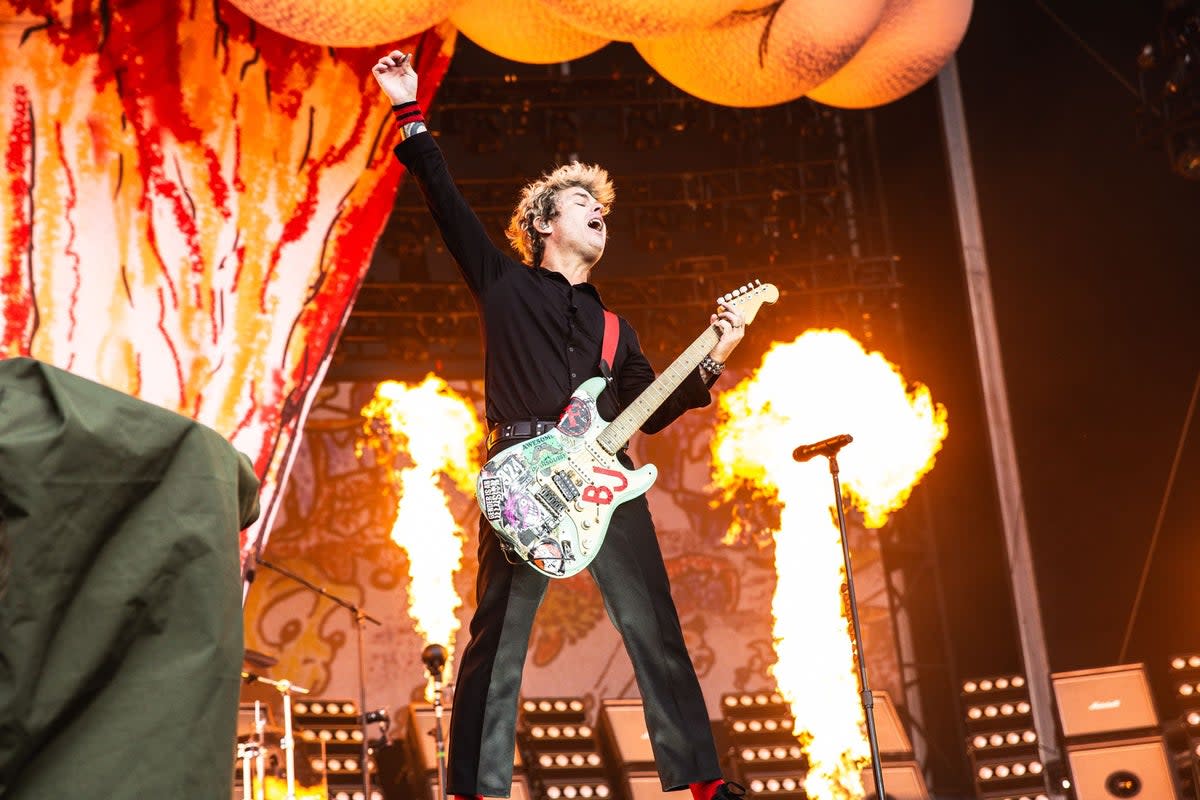 Green Day frontman Billie Joe Armstrong, along with bassist and backing vocalist Mike Dirnt, and drummer Tre Cool, perform a sold-out show at Emirates Old Trafford on the opening night of The Saviors tour (Myles Wright/ZUMA Press Wire/Shutterstock)