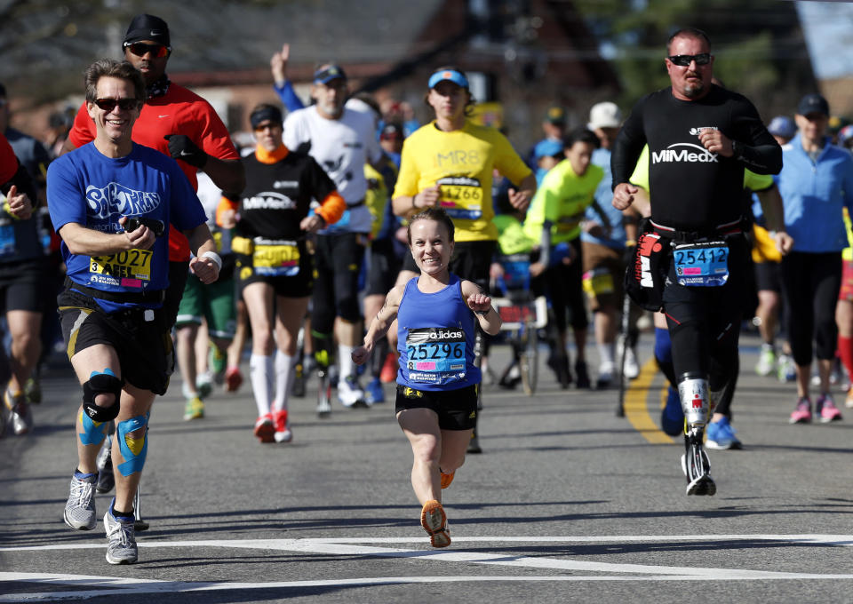 Mobility-impared runners David Abel, left, Juli Windsor, and Scott Rigsby compete in the 118th Boston Marathon Monday, April 21, 2014 in Hopkinton, Mass. (AP Photo/Michael Dwyer)