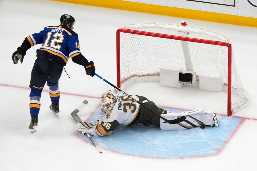 St. Louis Blues’ Kevin Hayes (12) is unable to score past Vegas Golden Knights goaltender Logan Thompson during the third period of an NHL hockey game Monday, March 25, 2024, in St. Louis. (AP Photo/Jeff Roberson)