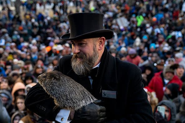 PUNXSUTAWNEY, PA - FEBRUARY 02: Groundhog handler AJ Derume holds Punxsutawney Phil, who saw his shadow, predicting a late spring during the 136th annual Groundhog Day festivities on February 2, 2023 in Punxsutawney, Pennsylvania. Groundhog Day is a popular tradition in the United States and Canada. A crowd of upwards of 5,000 people spent a night of revelry awaiting the sunrise and the groundhog's exit from his winter den. If Punxsutawney Phil sees his shadow he regards it as an omen of six more weeks of bad weather and returns to his den. Early spring arrives if he does not see his shadow, causing Phil to remain above ground.
 (Photo by Michael Swensen/Getty Images)