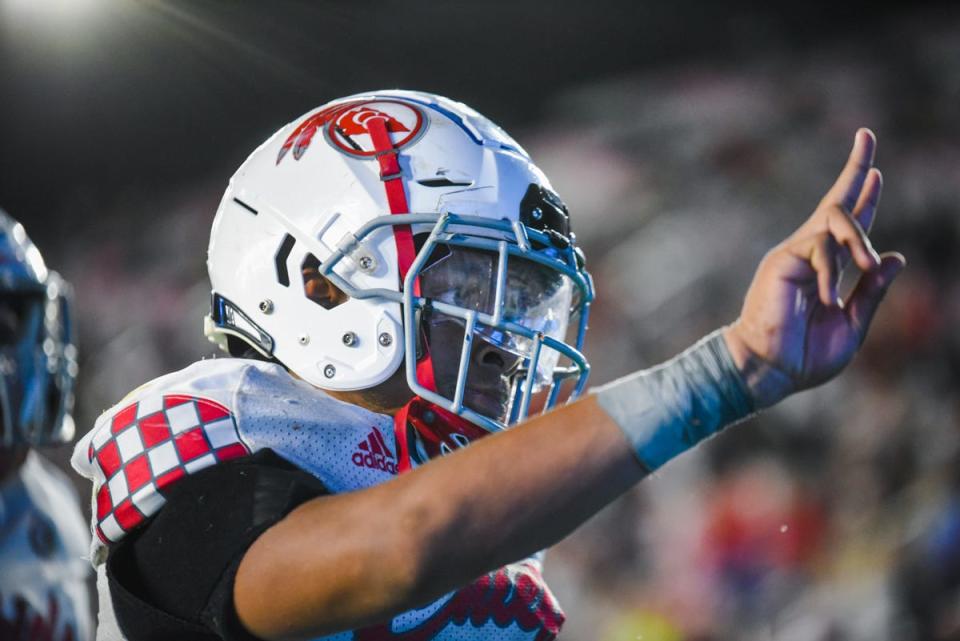 Gibbons running back Kamari Moulton (19) celebrates back-to-back touchdowns during the Class 4A State Championship game between Cardinal Gibbons and Cocoa at DRV PNK Stadium in Fort Lauderdale, FL., on Thursday, December 16, 2021. Final score, Gibbons 21, Cocoa, 19.