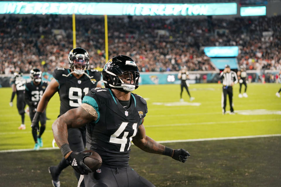 Jacksonville Jaguars linebacker Josh Allen (41) celebrates after intercepting a pass during the second half of an NFL football game against the Cincinnati Bengals, Monday, Dec. 4, 2023, in Jacksonville, Fla. (AP Photo/John Raoux)