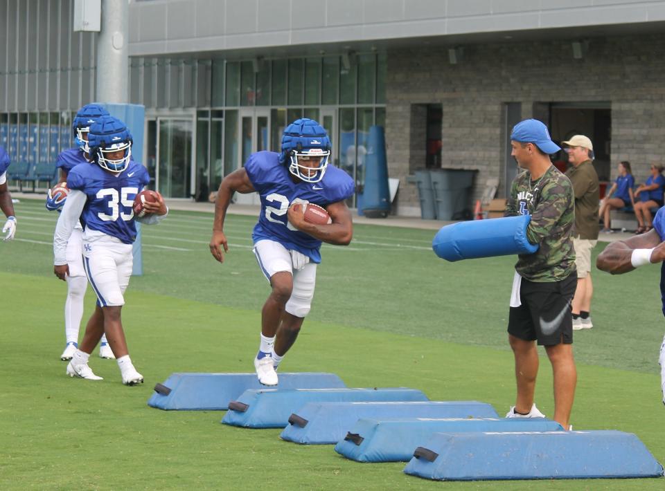 Running back Torrance Davis participates in a drill during a Kentucky football practice in advance of the 2021 season.