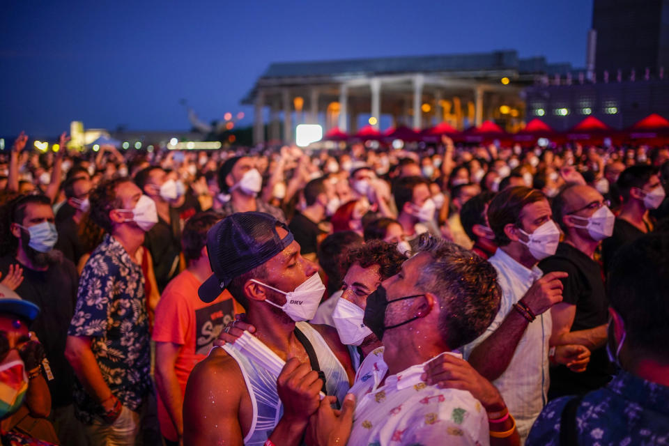 People take part in the Cruilla music festival in Barcelona, Spain, Friday, July 9, 2021. (AP Photo/Joan Mateu)