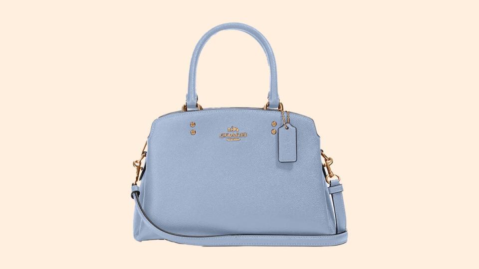 This Mini Lillie bag features a zipping compartment between two snap closure compartments so you can take more essentials with you.