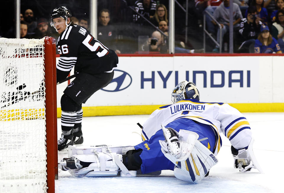 New Jersey Devils left wing Erik Haula (56) scores a goal against Buffalo Sabres goaltender Ukko-Pekka Luukkonen, right, during the second period of an NHL hockey game, Friday, Oct. 27, 2023, in Newark, N.J. (AP Photo/Noah K. Murray)