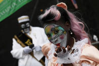 <p>A member of the New Orleans Baby Doll Ladies blows a kiss during the Krewe of Zulu parade at Mardi Gras in New Orleans, Louisiana U.S., February 28, 2017. (Shannon Stapleton/Reuters) </p>