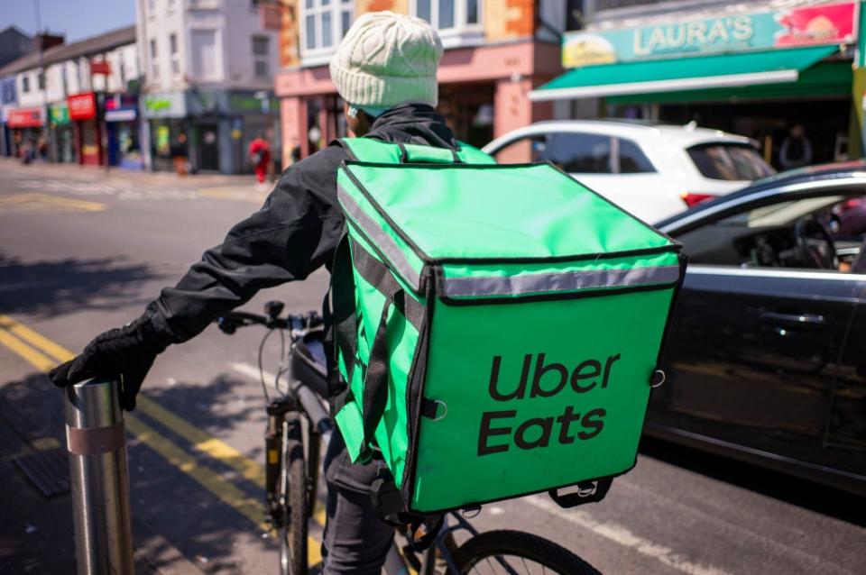 An Uber Eats driver on a bike in Cardiff, Wales