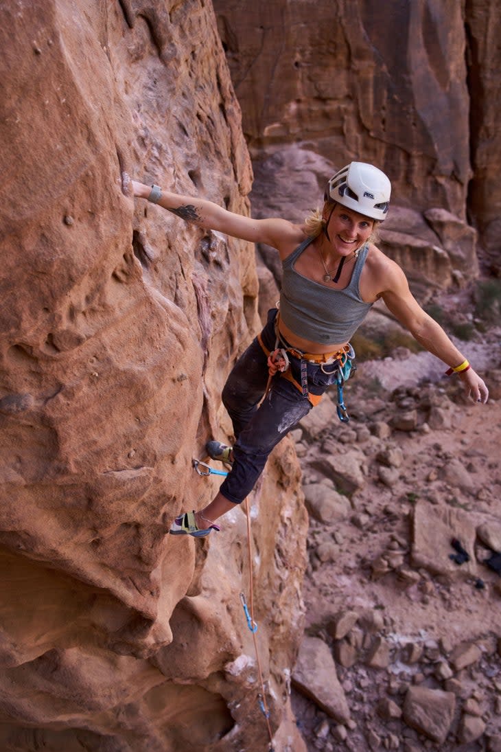 <span class="article__caption">Pro climber Emily Harrington quests up, all smiles. (Photo: Jake Holland)</span>