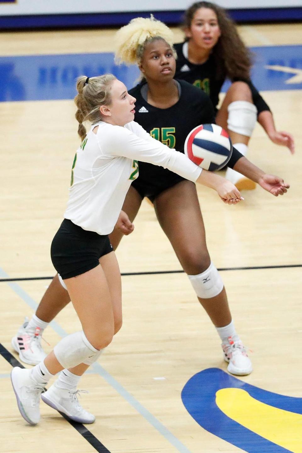 Bryan Station’s Olivia Bennett, left, bumps the ball during the 42nd District volleyball finals against Frederick Douglass in 2021. Bennett is now a freshman at San Diego and will face Kentucky in the NCAA Sweet 16 on Thursday night.