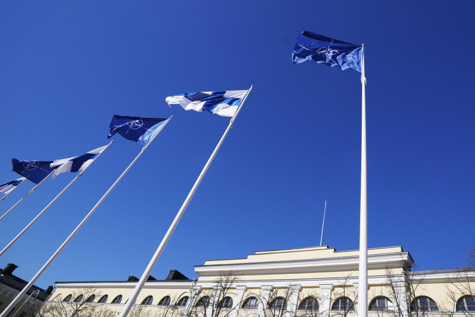 NATO and Finland flags flutter over the building of Ministry of Foreign Affairs in Helsinki, Finland, Tuesday, April 4, 2023. Finland prepared to make its historic entry into NATO Tuesday, a step that doubles the Western alliance’s border with Russia and ends decades of non-alignment for the Nordic nation. (AP Photo/Sergei Grits)