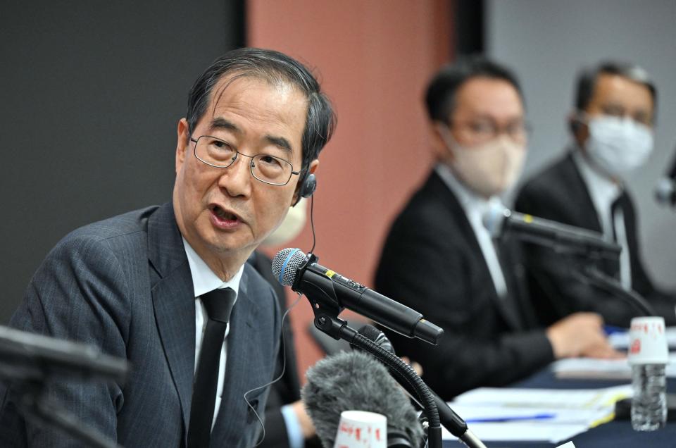 South Korea’s Prime Minister Han Duck-soo speaks during a media briefing on the fatal Halloween crowd surge that killed over 150 people, at Korea’s Culture and Information Service Center in Seoul on 1 November 2022 (AFP via Getty Images)