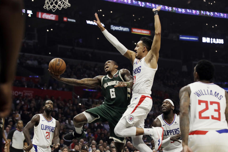 Milwaukee Bucks' Eric Bledsoe (6) drives to the basket as Los Angeles Clippers' Landry Shamet, center right, defends during the second half of an NBA basketball game Wednesday, Nov. 6, 2019, in Los Angeles. (AP Photo/Marcio Jose Sanchez)