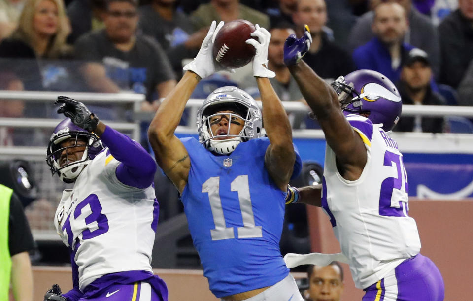 <p>Detroit Lions wide receiver Marvin Jones (11), guarded by Minnesota Vikings cornerbacks Terence Newman (23) and Xavier Rhodes (29), catches a 43-yard pass for a touchdown during the second half of an NFL football game, Thursday, Nov. 23, 2017, in Detroit. (AP Photo/Rick Osentoski) </p>