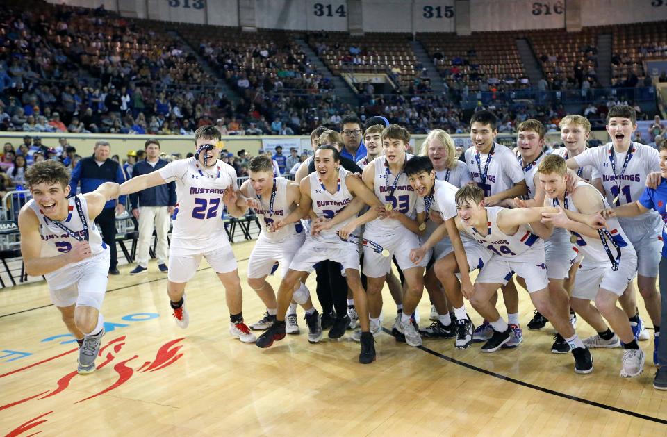 Fort Cobb-Broxton celebrates the Class B boys state basketball championship over Calumet at the State Fair Arena in Oklahoma City, Saturday, March 4, 2023.