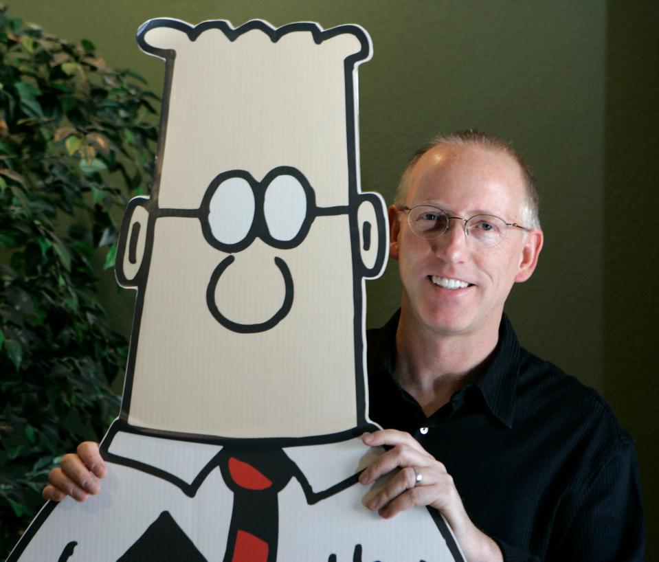 Scott Adams, creator of the comic strip Dilbert, poses for a portrait with the Dilbert character in his studio in Dublin, Calif., Oct. 26, 2006. Several prominent media publishers across the U.S. are dropping the Dilbert comic strip after Adams, its creator, described people who are Black as members of “a racist hate group” during an online video show.