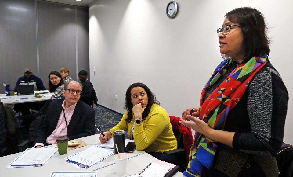Georgina Manley, right, partnership coordinator for the Chicago Regional Census Committee, takes questions from participants attending a census training session in Milwaukee.
