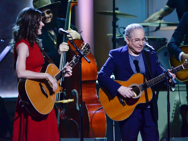 <p>Kris Connor/Getty</p> Edie Brickel and Paul Simon perform during the 2015 Gershwin Prize ceremony honoring Willie Nelson in Washington, D.C. in November 2015