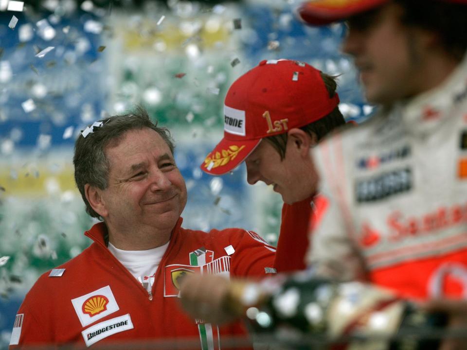 Ferrari team director Jean Todt, left, celebrates with Finland's Kimi Raikkonen as Spain's Fernando Alonso sprays champagne after the Brazilian Formula One Grand Prix.