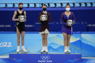 From left, silver medalist, Alexandra Trusova, of the Russian Olympic Committee, gold medalist, Anna Shcherbakova, of the Russian Olympic Committee, and bronze medalist, Kaori Sakamoto, of Japan, pose during a venue ceremony after the women's free skate program during the figure skating competition at the 2022 Winter Olympics, Thursday, Feb. 17, 2022, in Beijing. (AP Photo/Bernat Armangue)