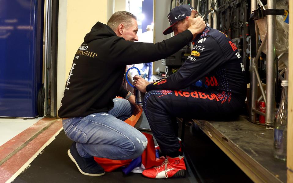 A tearful Max with his father after becoming world champion in 2021