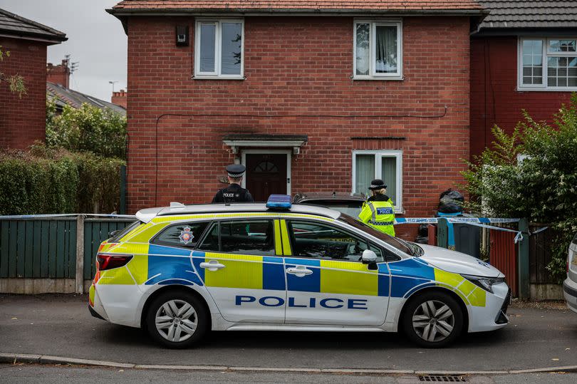 Police on Platt Lane after a murder investigation was launched