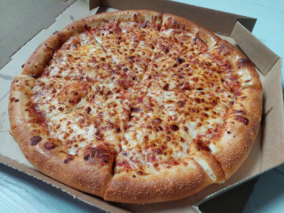 Cheese and tomato pizza from Pizza Hut, displayed in a box