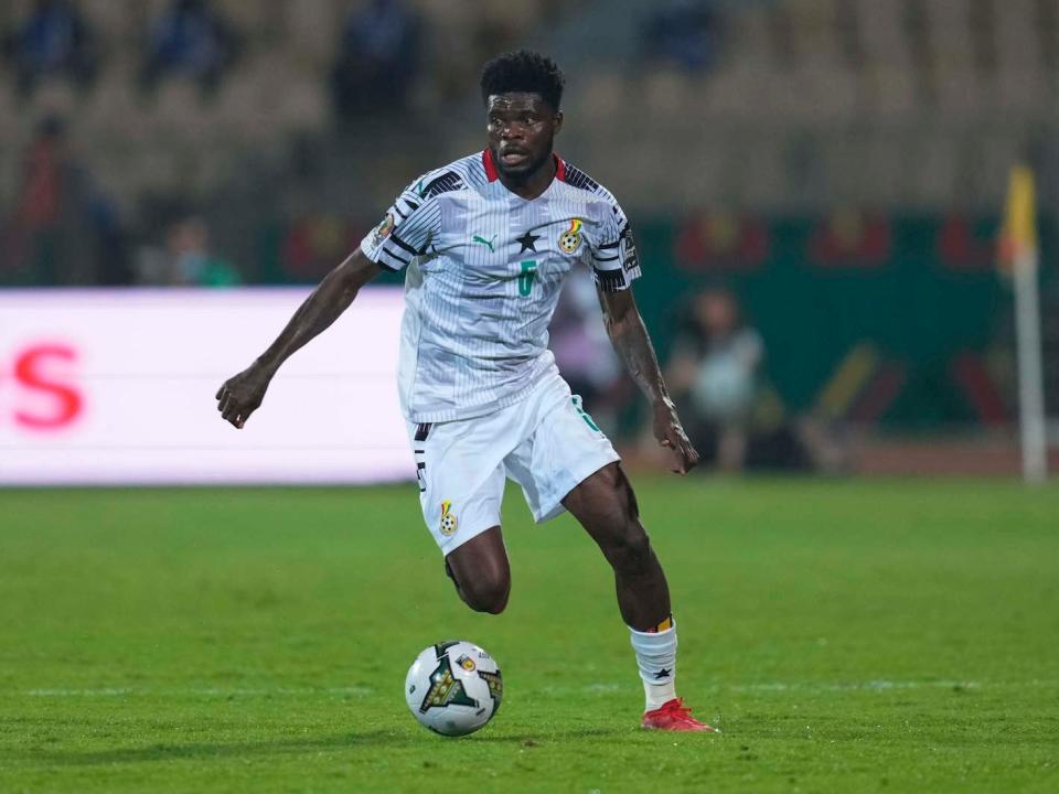 Thomas Partey of Ghana dribbles with the ball during a soccer match.