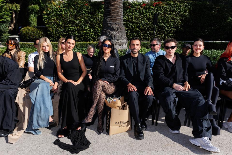 GQ cover star Kim Kardashian and Kendall Jenner in the star-studded front row.