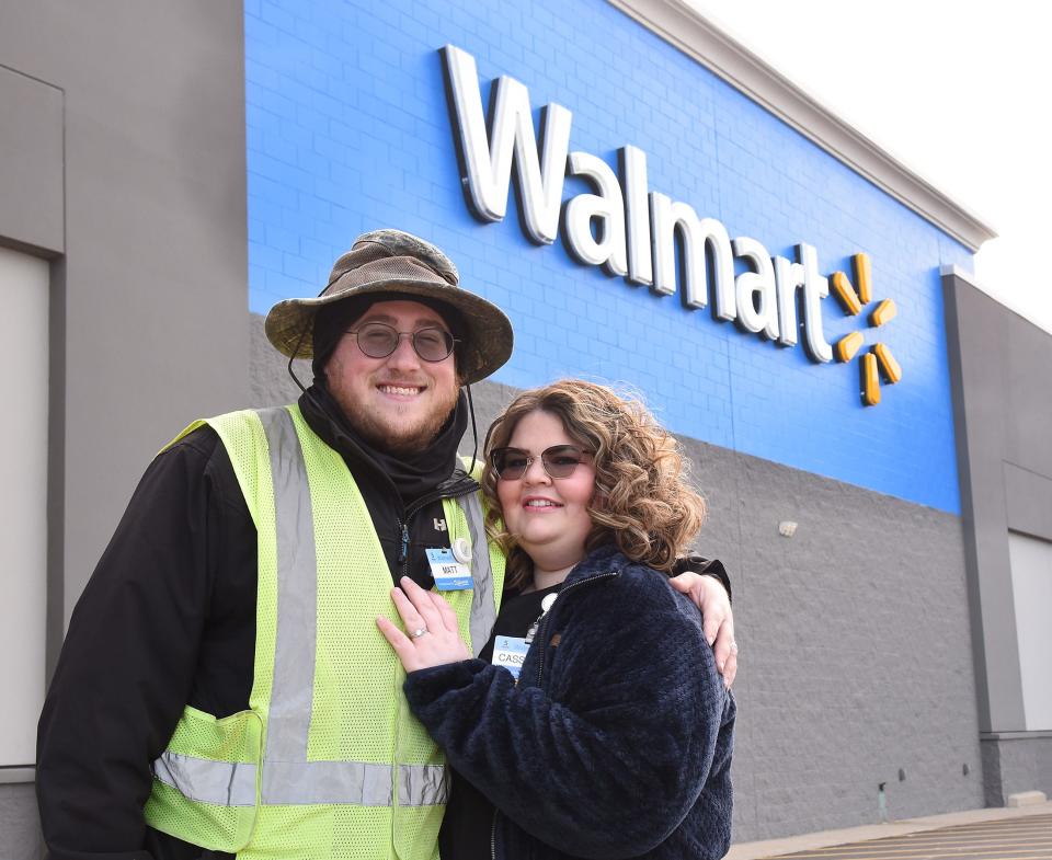 Matthew and Cassandra (Baumia) Keister of Monroe are shown outside the Monroe Walmart store where they met and still work.