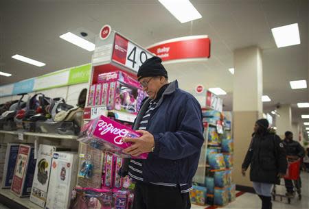 People shop at a Target store during Black Friday sales in the Brooklyn borough of New York, November 29, 2013. REUTERS/Eric Thayer