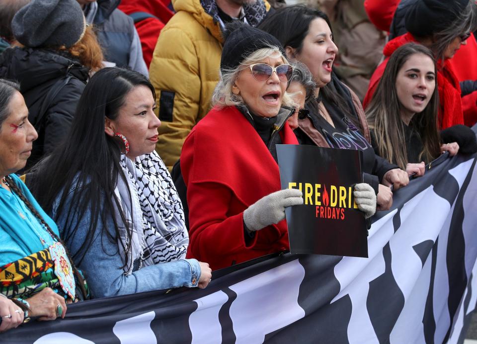 Jane Fonda leads hundreds of people in a march from the U.S. Capitol to the White House as part of her "Fire Drill Fridays" rally protesting against climate change in Washington, D.C., on Friday.