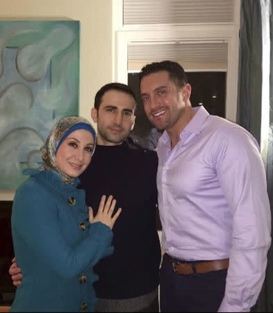 Amir Hekmati (C) poses with his sister Sarah Hekmati, and brother-in-law Ramy Kurdi after meeting for the first time since his release at Landstuhl Regional Medical Center in Landstuhl, Germany January 18, 2016. REUTERS/The Hekmati Family/Handout via Reuters