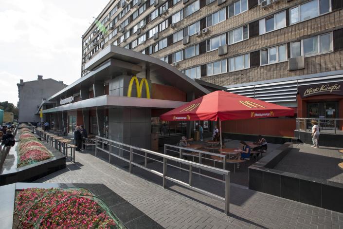 FILE - The oldest of Moscow's McDonald's outlets, which was opened on Jan. 31, 1990, is closed on Aug. 21, 2014. McDonald’s says it's started the process of selling its Russian business, which includes 850 restaurants that employ 62,000 people. The fast food giant pointed to the humanitarian crisis caused by the war, saying holding on to its business in Russia “is no longer tenable, nor is it consistent with McDonald’s values.” The Chicago-based company had temporarily closed its stores in Russia but was still paying employees. (AP Photo/FILE)