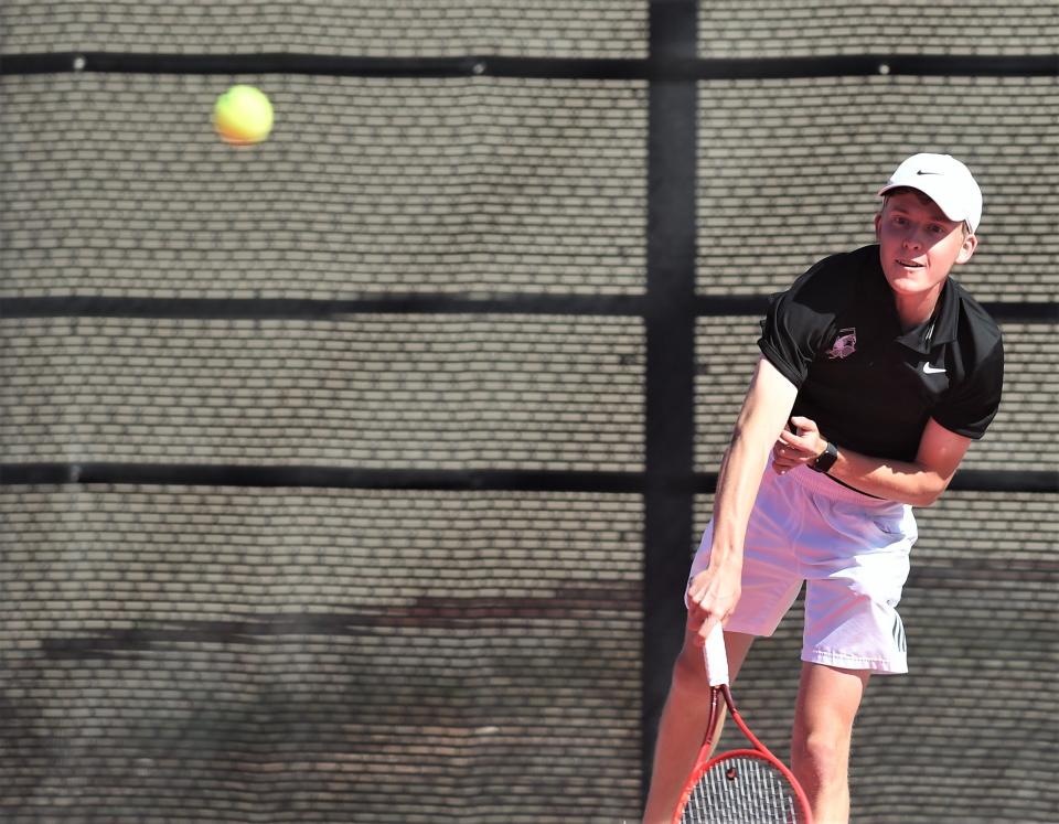 Abilene High's Griffin Sullivan watches his serve to Wylie's Brandon Cowling in a boys singles playback match at the Region I-5A tournament.