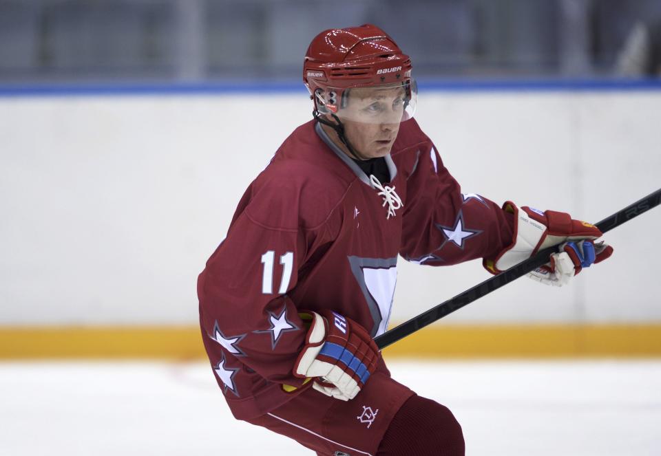 Russia's President Vladimir Putin takes part in a friendly ice hockey match in the Bolshoi Ice Palace near Sochi