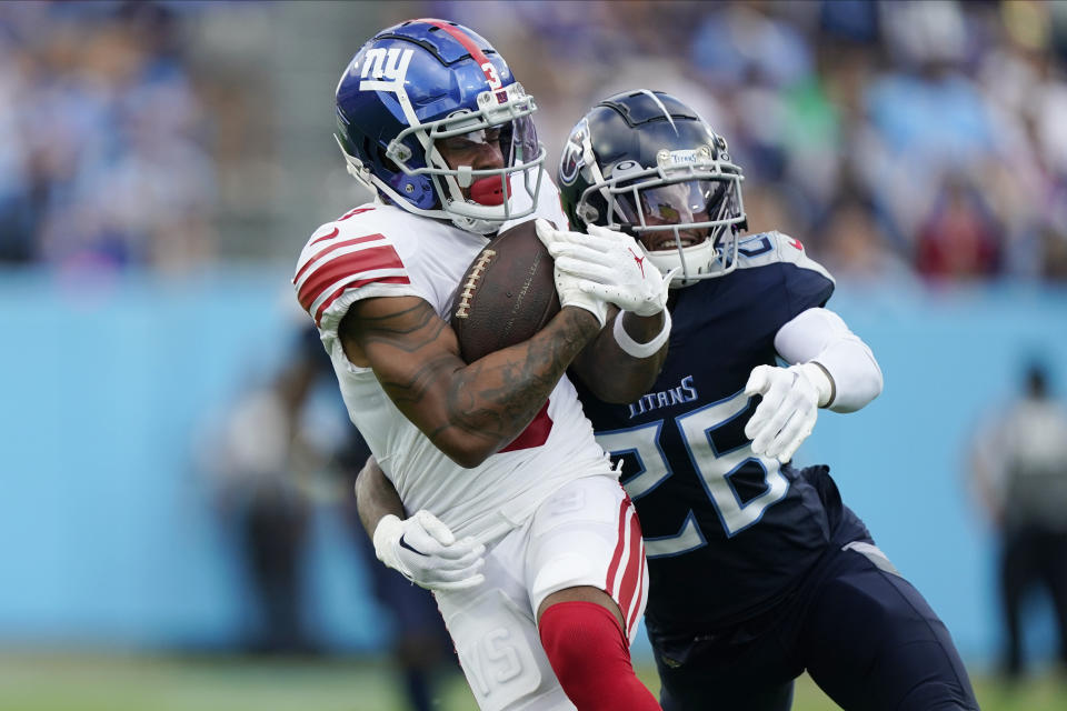 New York Giants wide receiver Sterling Shepard (3) breaks away from Tennessee Titans cornerback Kristian Fulton (26) for a touchdown after making a catch during the second half of an NFL football game Sunday, Sept. 11, 2022, in Nashville. (AP Photo/Mark Humphrey)