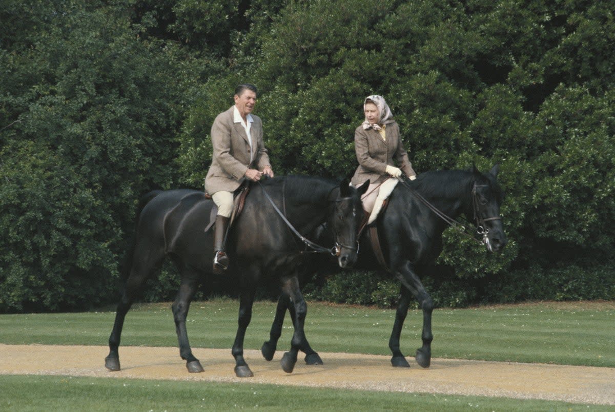 The Queen riding with Ronald Reagan at Windsor in June 1982. The US president wrote in his diary that the day had been ‘a fairy tale experience’  (Getty)