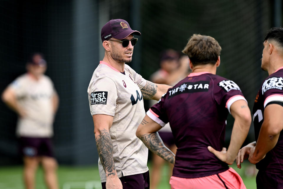 BRISBANE, AUSTRALIA - MARCH 21: Darius Boyd looks to be giving some tactical advice to Reece Walsh and Kotoni Staggs during a Brisbane Broncos NRL training session at Clive Berghofer Field on March 21, 2023 in Brisbane, Australia. (Photo by Bradley Kanaris/Getty Images)