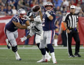 New England Patriots quarterback Brian Hoyer passes under pressure from Philadelphia Eagles defensive end Steven Means (51) during the second half of a preseason NFL football game, Thursday, Aug. 16, 2018, in Foxborough, Mass. (AP Photo/Mary Schwalm)