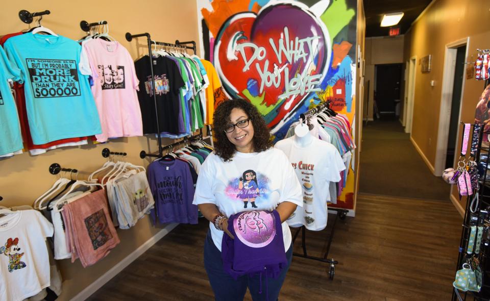 Anna Escobedo, owner of Better Than Ur's Designs poses for a portrait in the main sales floor of her Delta Township boutique. The store features pop-up shops on weekends.