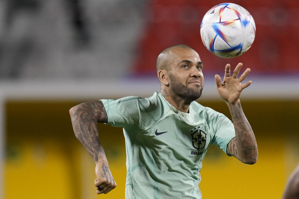 FILE - Brazil's Dani Alves practices during a training session at the Grand Hamad stadium in Doha, Qatar, on Dec. 4, 2022. Brazilian soccer star Dani Alves will be tried this week for allegedly sexually assaulting a young woman at a Barcelona night club in December 2022. The trial is scheduled for Monday through Wednesday at a Barcelona courthouse. (AP Photo/Andre Penner, File)