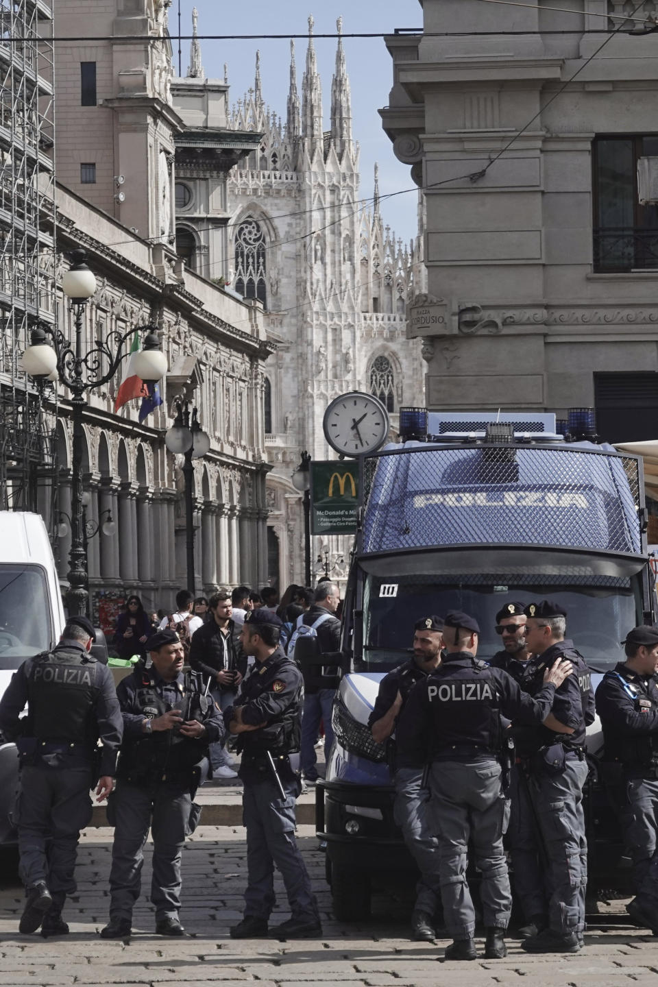 Police patrol nearby the Milan gothic cathedral in Milan, Monday, March 25, 2024. Italy followed France Monday in stepping up its security stance following the attack on a suburban Moscow concert hall and the claim of responsibility by an affiliate of the Islamic State group. (AP Photo/Luca Bruno)